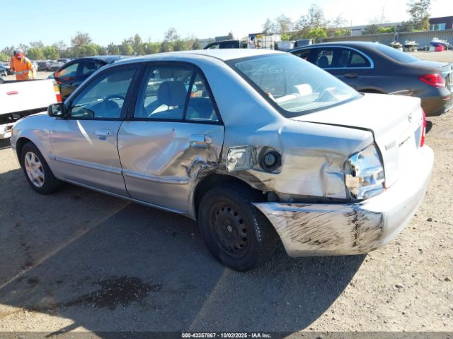 1999 MAZDA PROTEGE JM1BJ2223X0149383 Photo 2