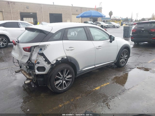 Mazda pe 2016 JM1DKFD70G0130201 Image 4