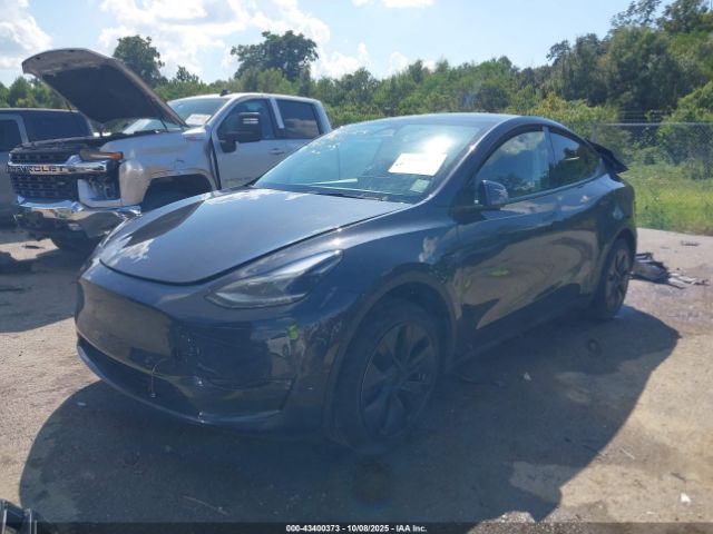 2024 TESLA MODEL Y 7SAYGDED8RF197535 Photo 1