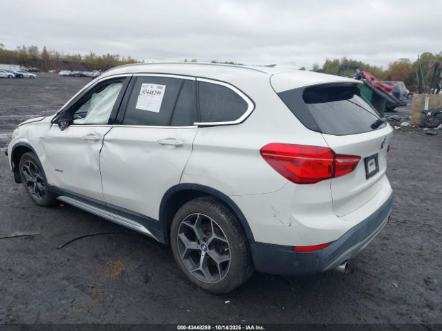 2017 BMW X1 WBXHT3C3XH5F86602 Photo 2