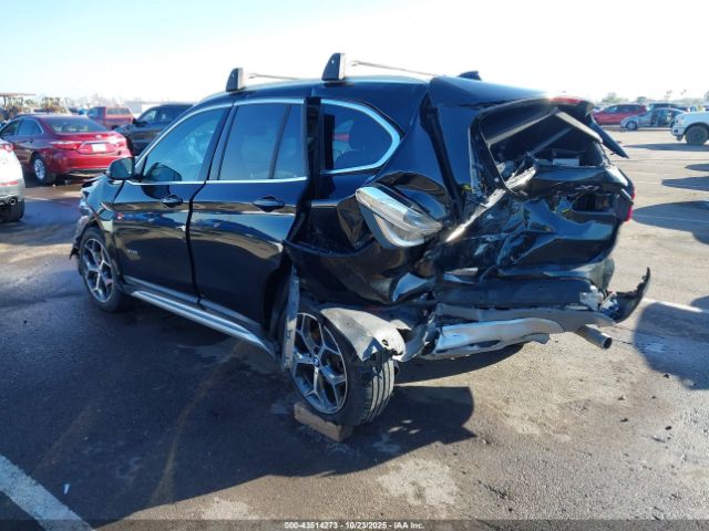 2018 BMW X1 WBXHT3C31J5K28498 Photo 2