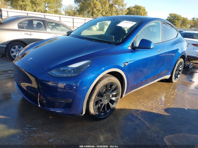 2024 TESLA MODEL Y 7SAYGDEEXRA283953 Photo 1