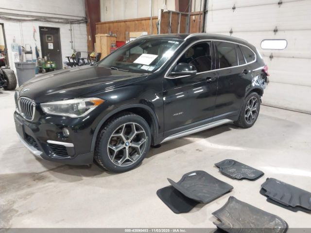 2016 BMW X1 WBXHT3C34G5E55910 Photo 1