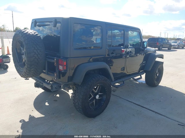 1C4BJWDG0EL311725 Jeep Wrangler Unlimited Sport