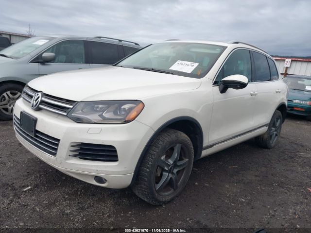 2011 VOLKSWAGEN TOUAREG WVGFF9BP0BD004841 Photo 1