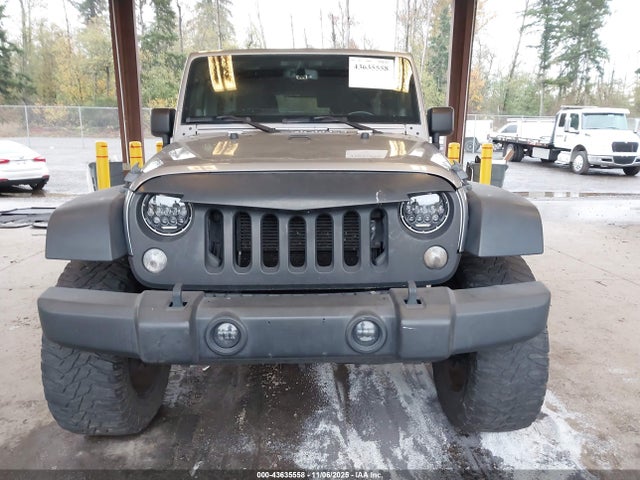 1C4HJWDGXEL190048 Jeep Wrangler Unlimited Sport