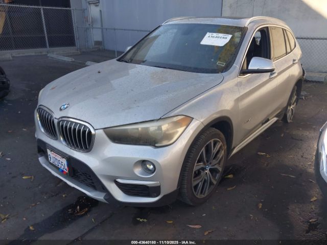 2017 BMW X1 WBXHT3C34H5F81864 Photo 1