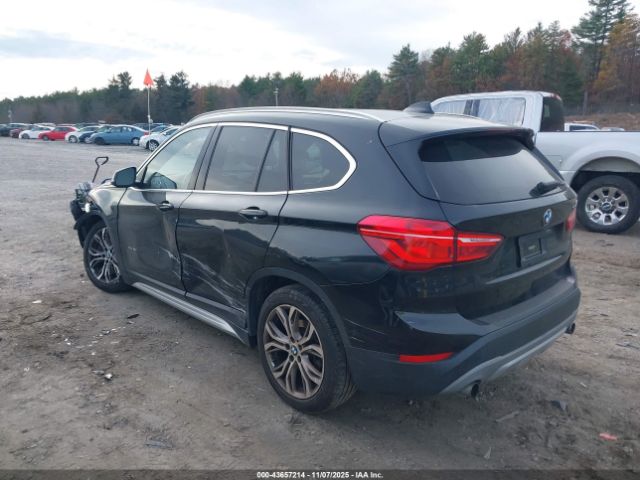 2016 BMW X1 WBXHT3C31G5E48381 Photo 2