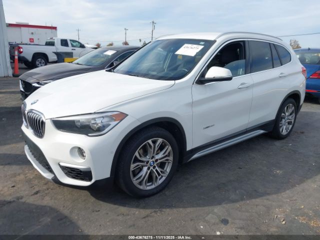 2017 BMW X1 WBXHT3C36H5F83048 Photo 1