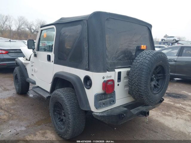 1999 JEEP WRANGLER 1J4FY19S8XP409324 Photo 2