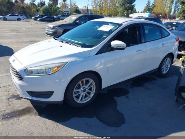 2015 FORD FOCUS 1FADP3F21FL206982 Photo 1