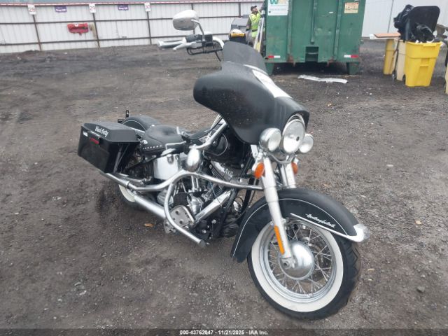 2011 HARLEY-DAVIDSON FLSTC 1HD1BW515BB019703