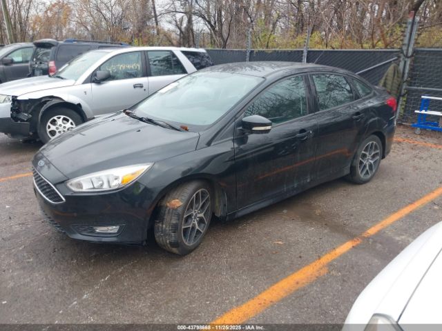 2015 FORD FOCUS 1FADP3F22FL385209 Photo 1