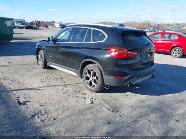 2016 BMW X1 WBXHT3C31G5E48347 Photo 2