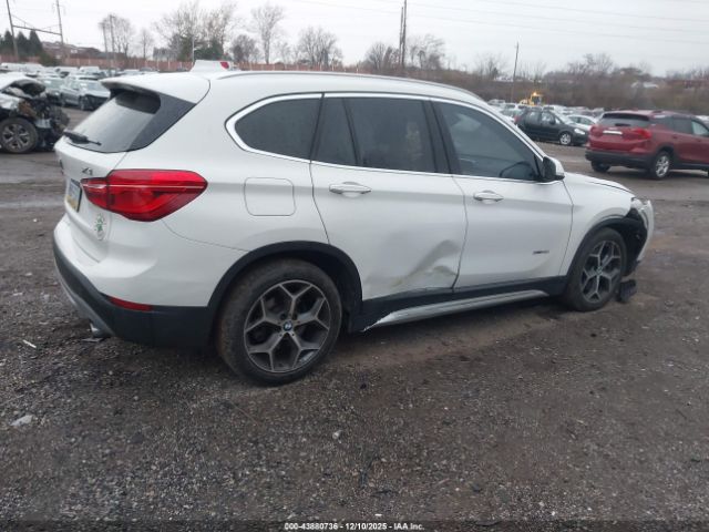 2016 BMW X1 WBXHT3C36G5E55276 Photo 3