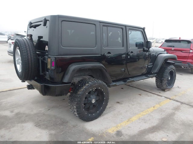 1C4BJWDG7EL149396 Jeep Wrangler Unlimited Sport