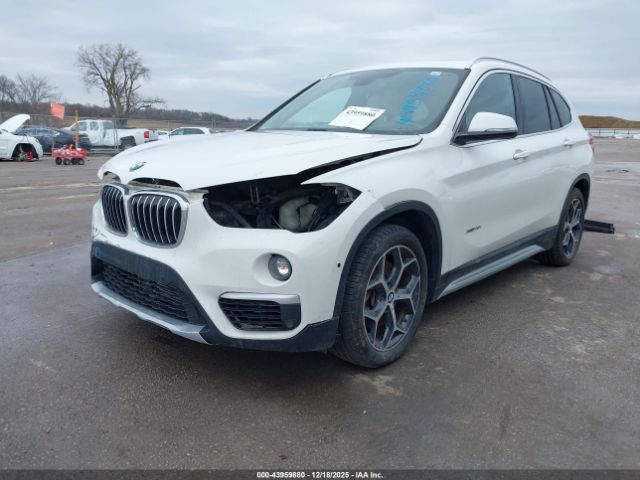 2016 BMW X1 WBXHT3C34G5F63928 Photo 1