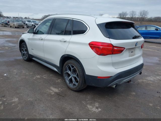 2016 BMW X1 WBXHT3C34G5F63928 Photo 2