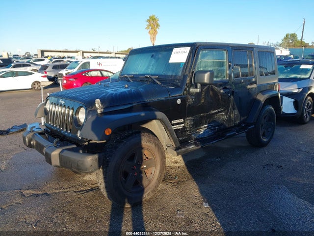 1C4BJWDG8EL140867 Jeep Wrangler Unlimited Sport