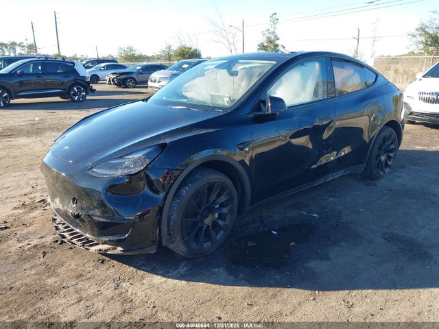 2024 TESLA MODEL Y 7SAYGDEE2RA214710 Photo 1