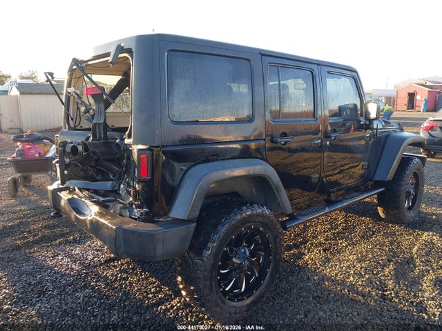 1C4HJWDG3EL197701 Jeep Wrangler Unlimited Sport