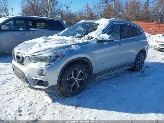 2016 BMW X1 WBXHT3C32GP889583 Photo 1