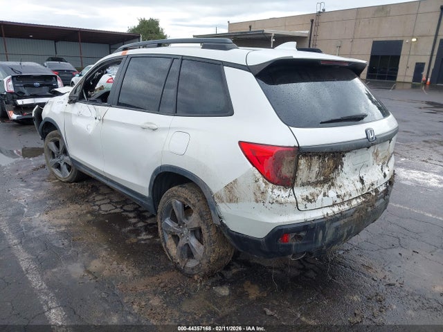 5FNYF8H9XKB017556 Honda Passport Touring