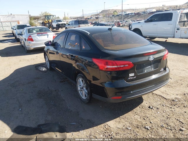 2015 FORD FOCUS 1FADP3F23FL241037 Photo 2