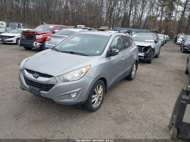 2012 HYUNDAI TUCSON KM8JUCACXCU424524 Photo 1