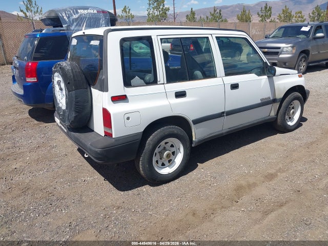 44949816 :رقم المزاد ، 2CNBJ1360T6908077 vin ، 1996 Geo Tracker مزاد بيع