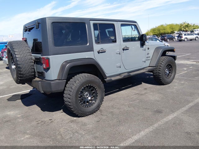 1C4HJWDG2EL271061 Jeep Wrangler Unlimited Sport