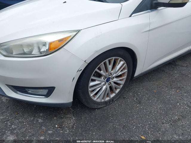 Продажа на аукционе авто 2016 Ford Focus Titanium, vin: 1FADP3N23GL307007, номер лота: 45292787