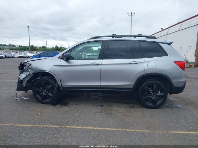 5FNYF8H0XKB002573 Honda Passport Elite