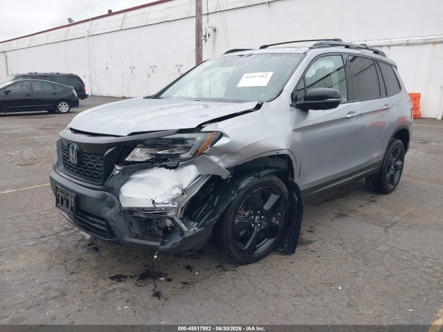 5FNYF8H0XKB002573 Honda Passport Elite