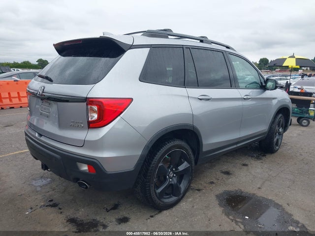 5FNYF8H0XKB002573 Honda Passport Elite