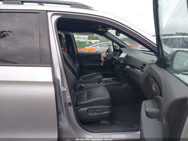 5FNYF8H0XKB002573 Honda Passport Elite