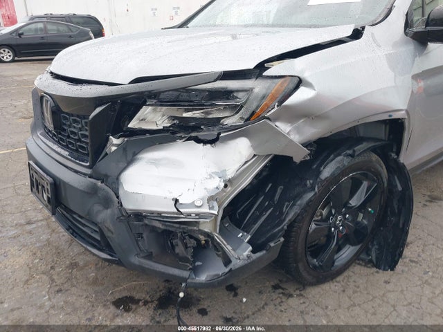 5FNYF8H0XKB002573 Honda Passport Elite