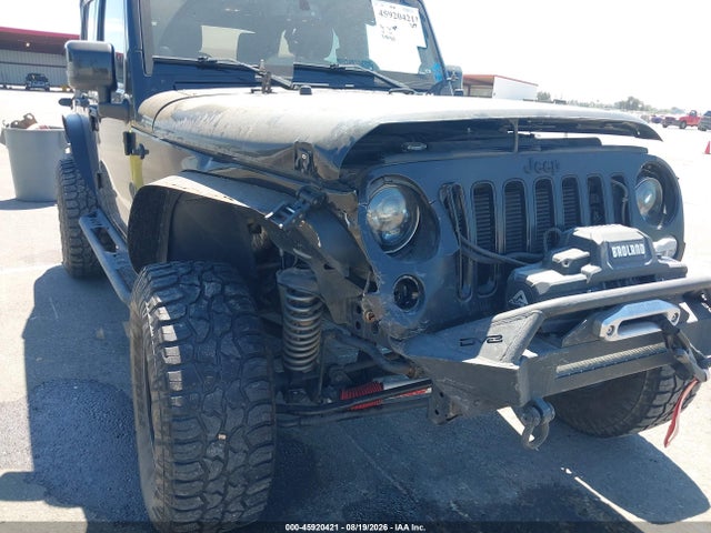 1C4BJWEG9EL324679 Jeep Wrangler Unlimited Altitude