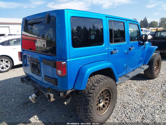 1C4HJWEG2EL303988 Jeep Wrangler Unlimited Sahara