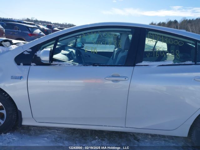 JTDKAMFP7M3164738 Toyota Prius