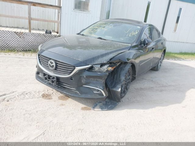 JM1GJ1W53G1402703 Mazda py