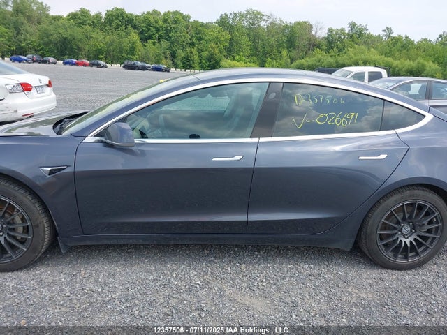5YJ3E1EA4JF026691 Tesla 2018