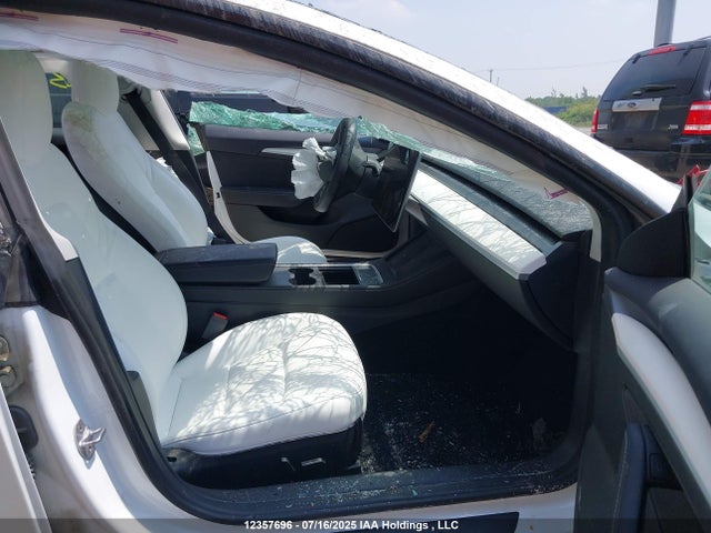 5YJ3E1EA0NF337394 Tesla 2022