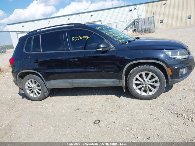 WVGJV3AX4EW597706 Volkswagen Tiguan