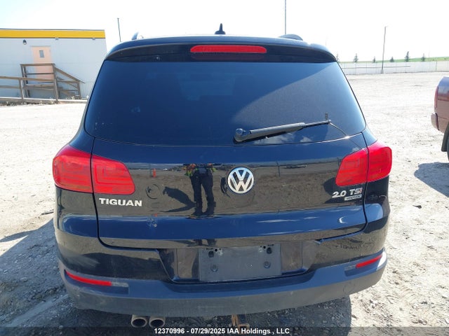 WVGJV3AX4EW597706 Volkswagen Tiguan