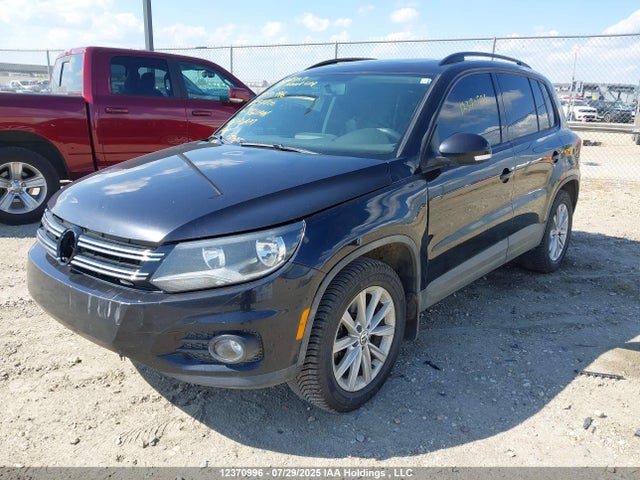 WVGJV3AX4EW597706 Volkswagen Tiguan