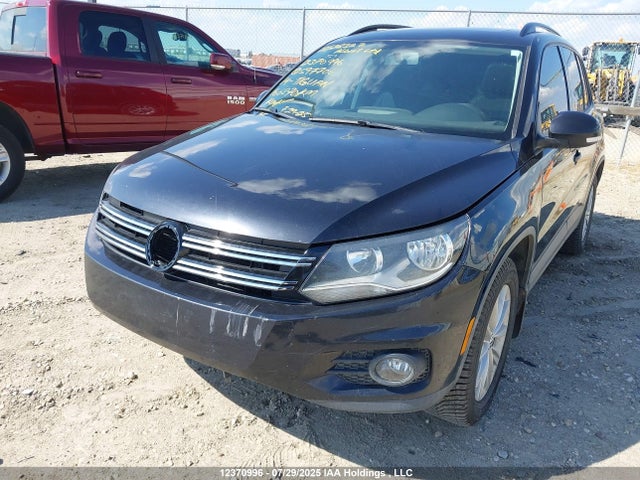 WVGJV3AX4EW597706 Volkswagen Tiguan