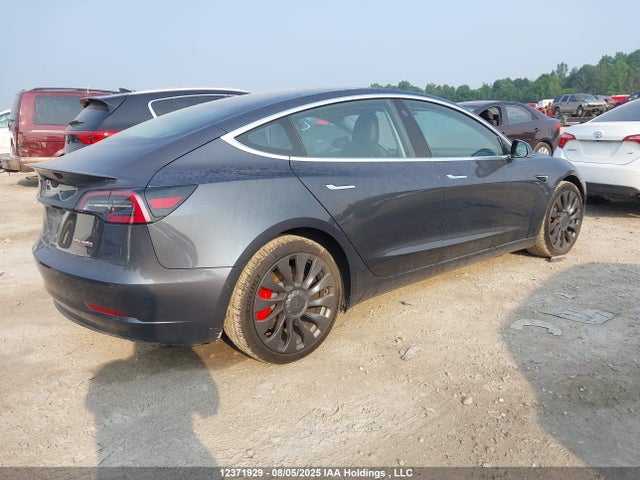 5YJ3E1EB1JF107799 Tesla 2018