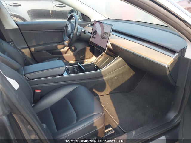 5YJ3E1EB1JF107799 Tesla 2018