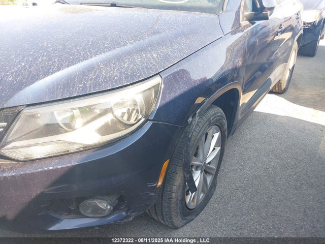 WVGJV3AX9EW586457 Volkswagen Tiguan